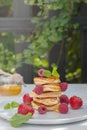 Pancakes with wild berries on the table. Healthy breakfast. Royalty Free Stock Photo