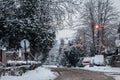 Residential street of Pancevo, Vojvodina, Serbia, covered in snow during a snowstorm in a cold winter afternoon with cars covered Royalty Free Stock Photo