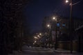 Selective blur on a road of Residential street of Pancevo, Vojvodina, full of snow during a snowstorm in a cold winter night Royalty Free Stock Photo