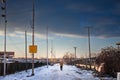 PANCEVO, SERBIA - JANURY 23, 2023: Panorama of a frozen street with snow with a man walking alone in a street covered in ice in
