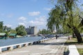 Pancevo, Serbia 4. May 2020.: Rowing training on the river Tamish on a nice sunny day and walkers by the river on the river bank