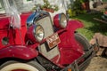 Pancevo, Serbia - September 27, 2019: Front side of red vintage 1928 Pontiac car parked in collectors museum courtyard