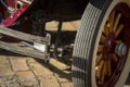 Pancevo, Serbia - September 27, 2019: Front wheel of red vintage 1928 Pontiac car parked in collectors museum courtyard