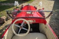 Pancevo, Serbia - September 27, 2019: Steering wheel of red vintage 1928 Pontiac car parked in collectors museum courtyard