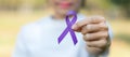 Pancreatic Cancer, world Alzheimer, epilepsy, lupus and domestic violence day Awareness month, Woman holding purple Ribbon for Royalty Free Stock Photo