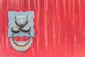 Panda chinese door knocker on a red gate