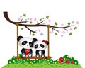 Panda Couple in love sitting on a swing under a tree at the park