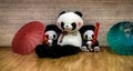 Panda family dolls with umbrellas