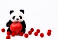 Panda Push Doll Embracing a red heart