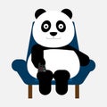Panda sitting on the sofa and old the remote in hand for watching television. Royalty Free Stock Photo