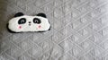 Panda sleep mask on a pillow ready for a sleep night  and soft cute dreams Royalty Free Stock Photo