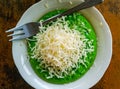 Pandan pancake topped with shredded chedar cheese