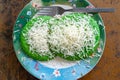 Pandan pancake topped with shredded chedar cheese