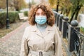 pandemic outdoors covid prevention woman mask park