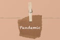Pandemic single word on cardboard latched. in coronavirus