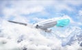 Pandemic travel concept. Airplane in a medical mask flies in the clouds.