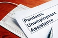 Pandemic Unemployment Assistance PUA and medical mask Royalty Free Stock Photo