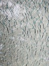 A pane of safety tempered glass shattered in many pieces. Royalty Free Stock Photo