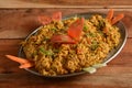 Paneer Bhurji, is a famous indian dish, served over a rustic wooden background, selective focus