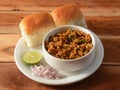 Paneer bhurji with Pav is a spicy paneer curry dish made up of paneer, onion, tomatoes and indian spices served with buns or pav, Royalty Free Stock Photo