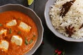Paneer Butter masala and cooked rice Indian Curry Dinner
