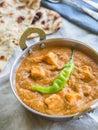 Paneer butter masala in a traditional copper pot.. Royalty Free Stock Photo