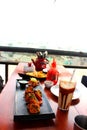 Paneer tikka served in black plate in open restaurant