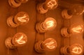 Panel of Glowing Lightbulbs with Filaments Lit Up