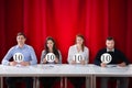 Panel Judges Holding 10 Score Signs