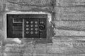 Panel management of the old on-door speakerphone on a concrete wall Royalty Free Stock Photo