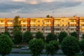 Panel residential building surrounded by greenery and trees. A green city in an ecologically clean area. The house is flooded with Royalty Free Stock Photo