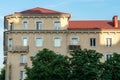 Panel residential building surrounded by greenery and trees. A green city in an ecologically clean area. The house is flooded with Royalty Free Stock Photo