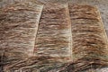 Panel of vetiver for hut roof, straw roof on ground, straw roof hut panel Royalty Free Stock Photo