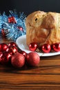 Panettone. Panettone with Christmas ornaments on rustic wooden table