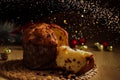 Panettone - Traditional italian Christmas cake and Christmas ligths Royalty Free Stock Photo