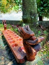 Indonesian traditional Javanese game made of wood in the shape of a dragon