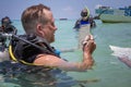 Panglao, Philippines - April 29, 2021: Scuba diver in confined water teaching, studying, evaluating skills