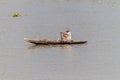 PANGUNCHI, BANGLADESH - NOVEMBER 19, 2016: Local man on a small wooden canoe on Pangunchi river, Banglade Royalty Free Stock Photo