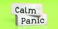 Panic, calm - words on wooden blocks Royalty Free Stock Photo
