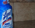 A close up bottle of Lysol on a kitchen counter