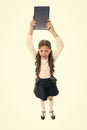 Panic before test. Cute small child reading book on white background. Adorable little girl learn reading copy space