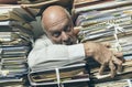 Panicked businessman overloaded with paperwork Royalty Free Stock Photo