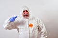 Panicked old man dresses in hazmat suit to go shopping. Royalty Free Stock Photo