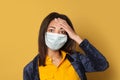 Panicking sick black woman on yellow. Epidemic and virus protection concept
