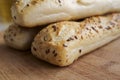 Panini rolls on a wooden board in a kitchen. Premium bread product with high quality and great taste. Healthy food