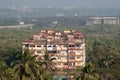 Aerial view of an old weathered building in a green environment in the city of Panaji