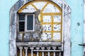 Detail of weathered windows of a vintage house in the Fontainhas area of Panjim