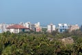 Skyline of the city of Panaji with modern high rises above green palm trees Royalty Free Stock Photo