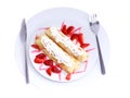 Pankcake with cream , with rolled fruit inside. Royalty Free Stock Photo