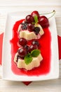 Panna cotta with cherries and cherry sauce.